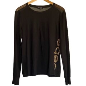 BEBE Thumb-hole Long sleeve shirt Size M. Black,Gold colored studs spelling Bebe